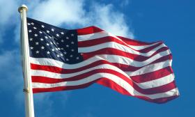 American Flag against a blue sky background