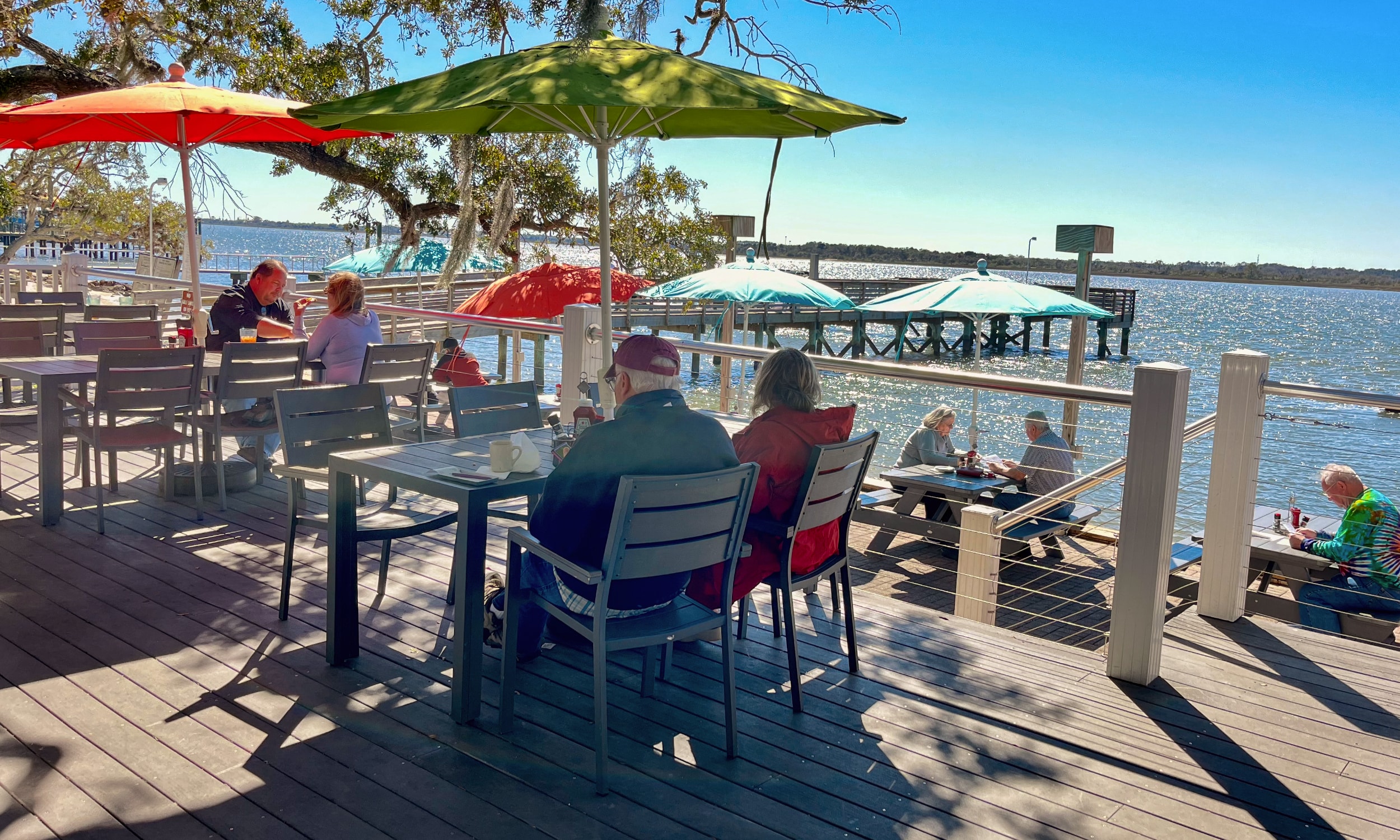 Diners enjoy the water views from the outside deck