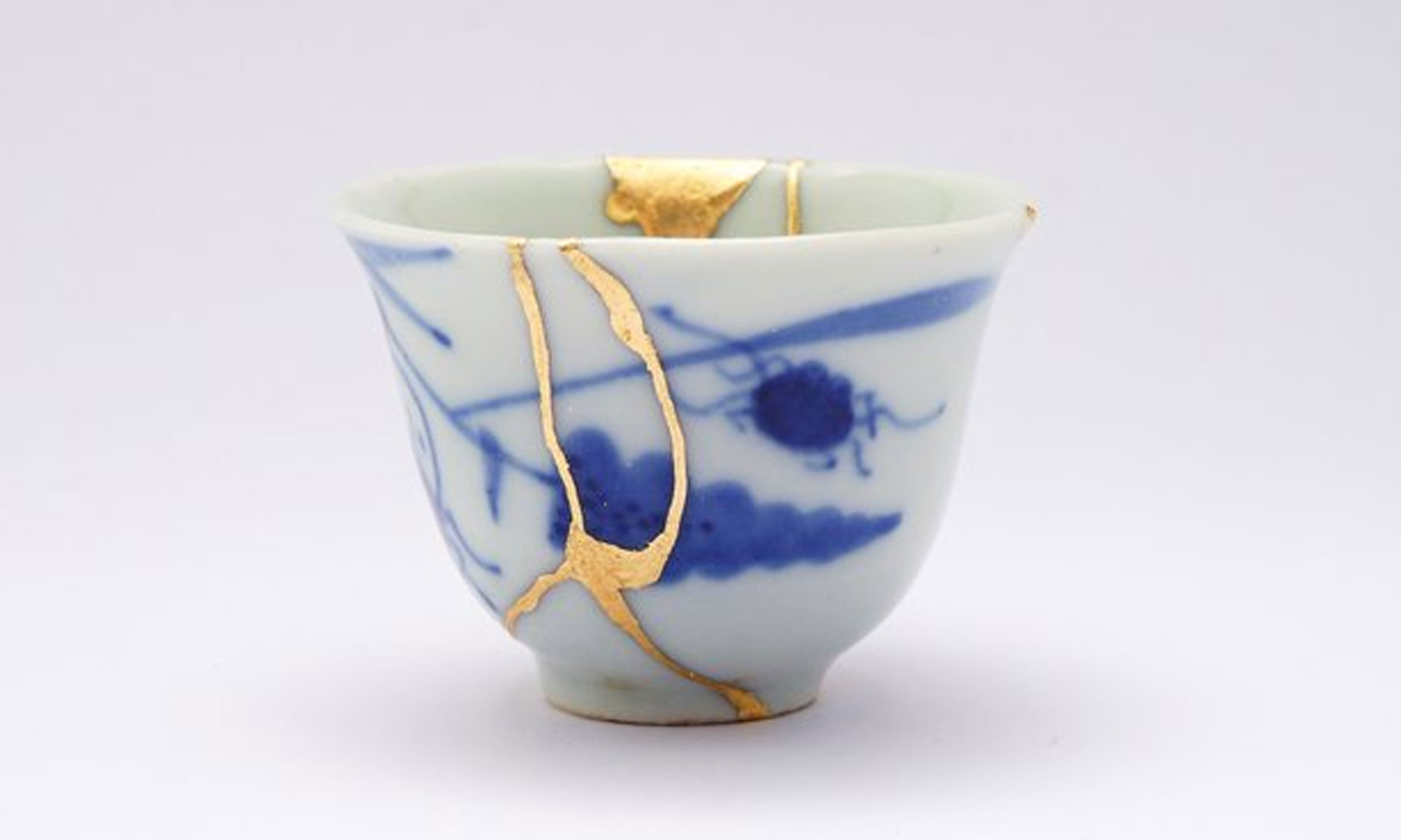 Art of Kintsugi repsesented in repaired teacup