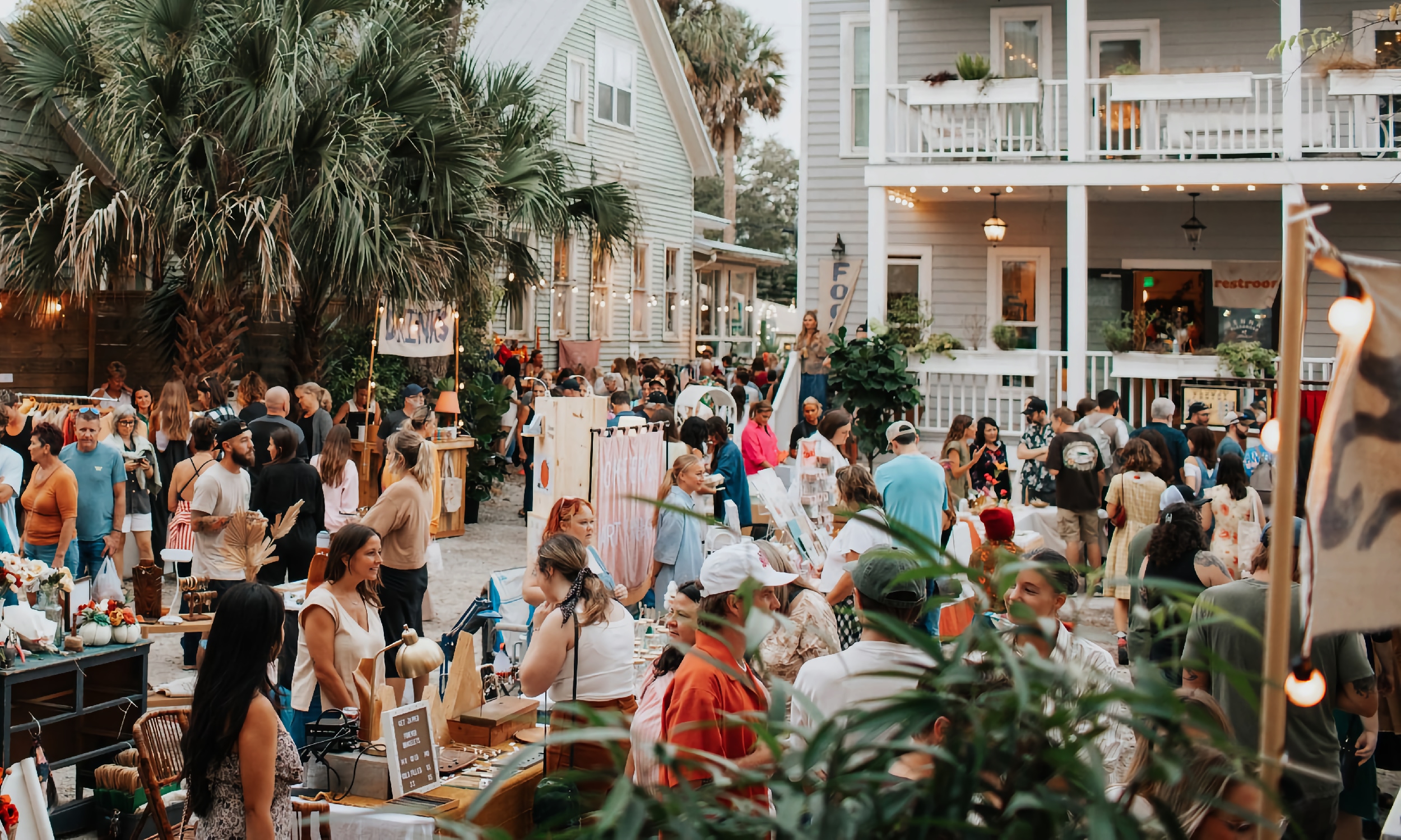 People attending the Secret Garden Market, shop at the vendor booths