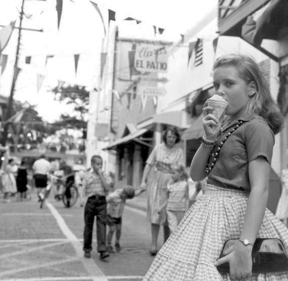 A young girl, in full skirt with a cone, during the St. Augustine Spanish festival in the 1960s