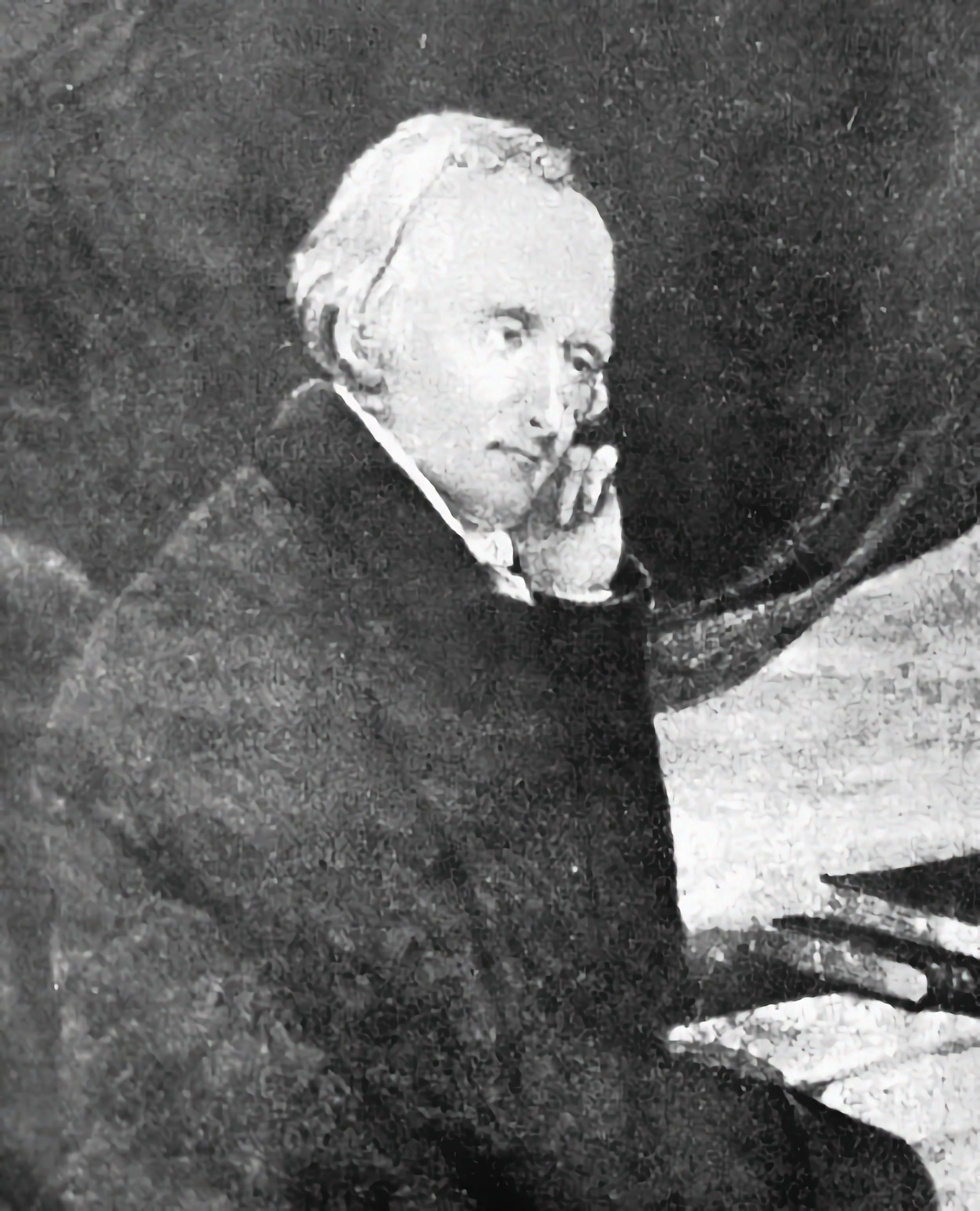 B&W illustration of an old White man with a receding bob hair cut at a desk.