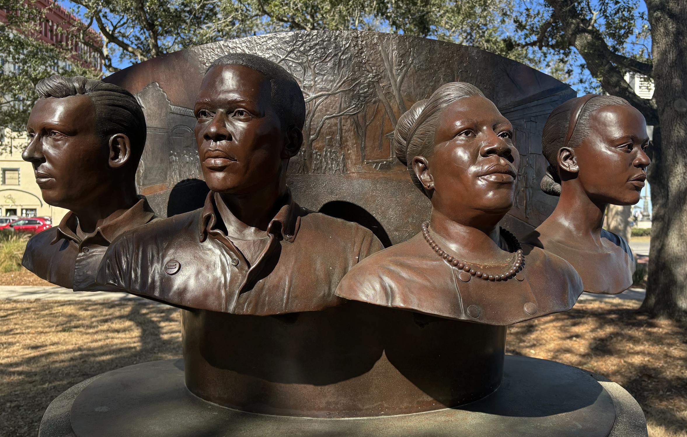 Close up of Bronze Foot Soliders monument, four busts.