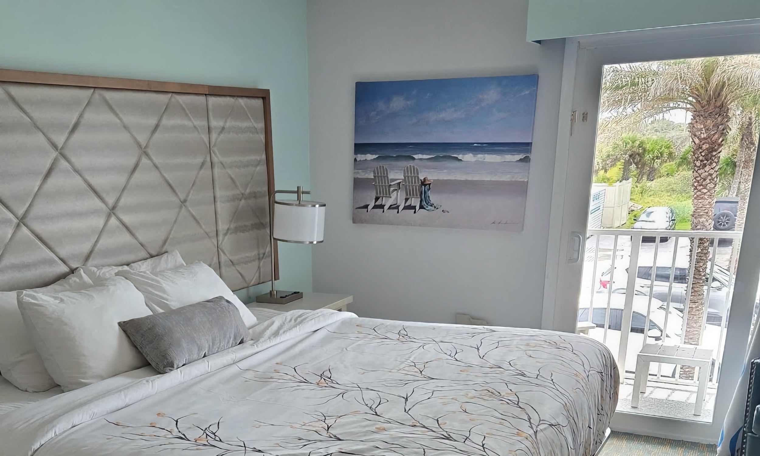 The room in a hotel shows a view that looks toward the marshland