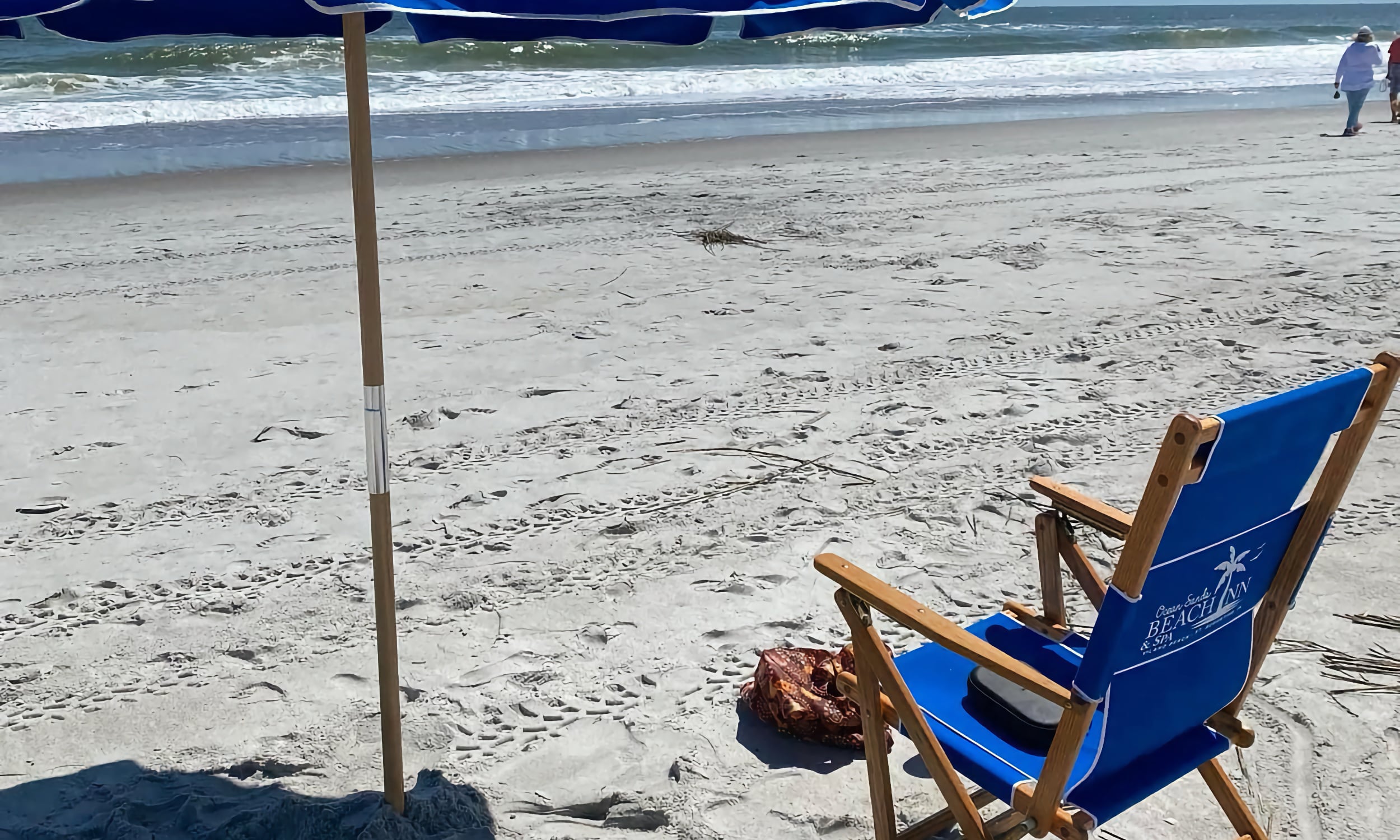 A blue chair on the beach