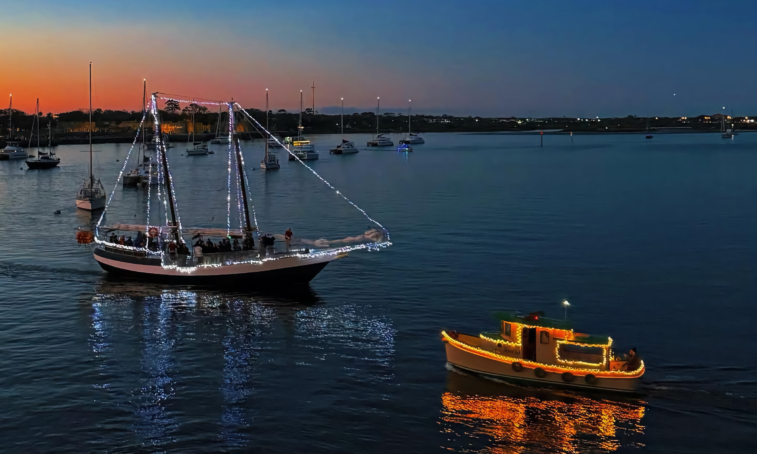 The Schooner Freedom meets the Tiny Tug Tours during Nights of Lights