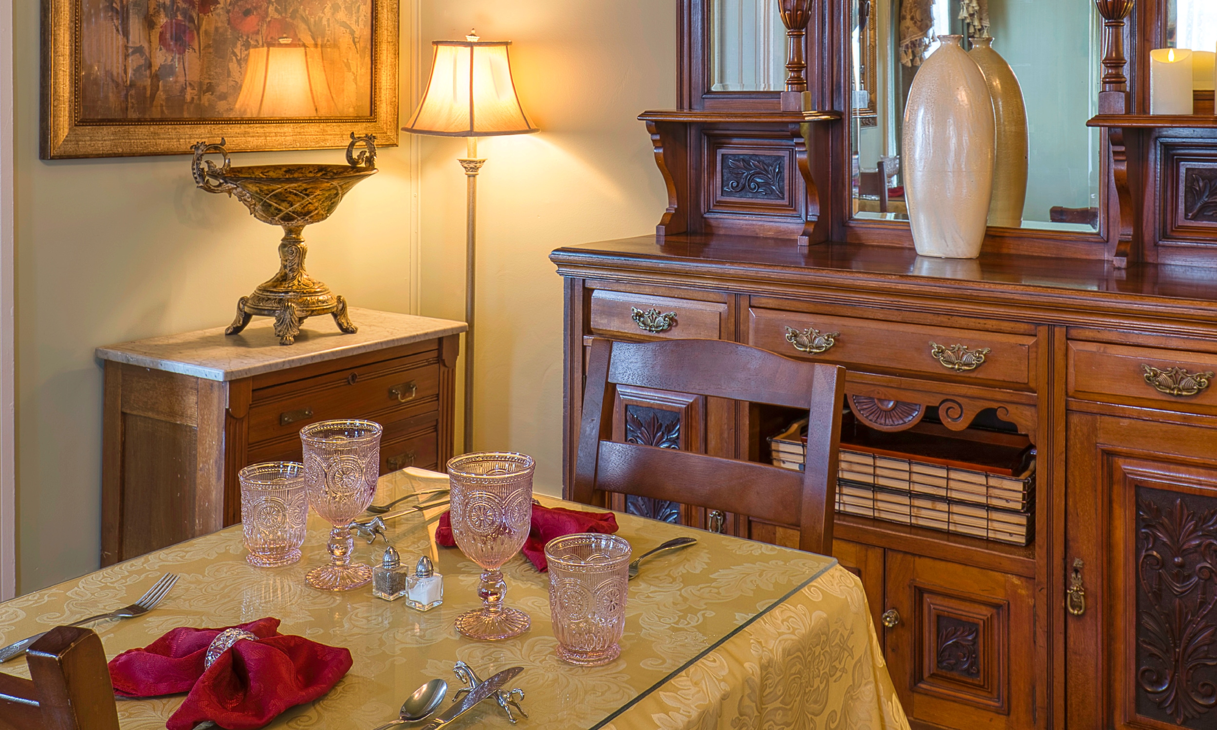 A corner of this breakfast area in this place to stay has a table set for two