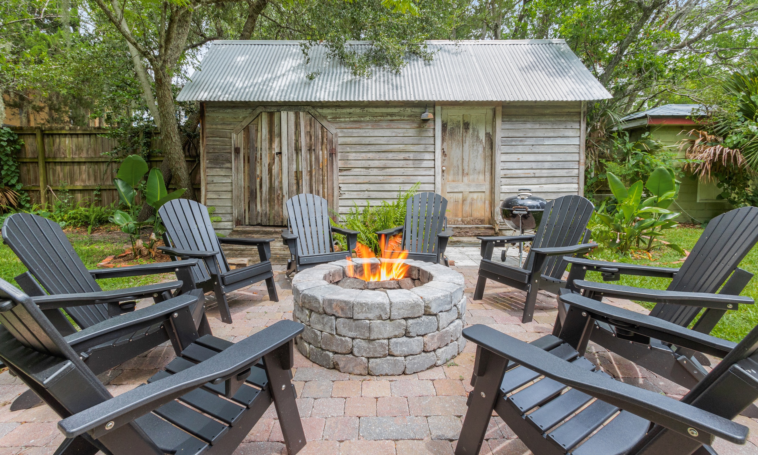 Chairs arranged around a fire pit at a downtown vacation rental in St. Augustine