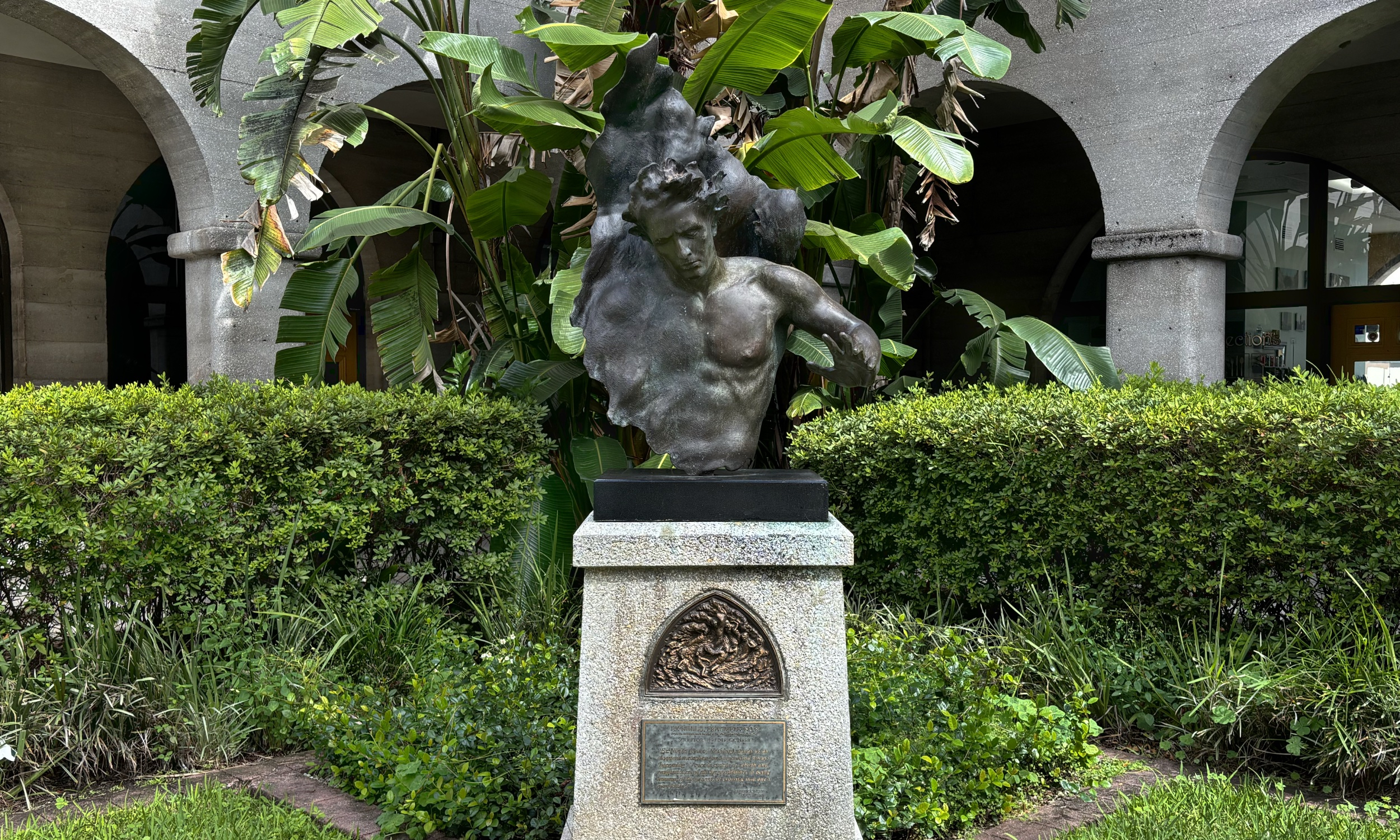 A bronze sculpture on a pedestal