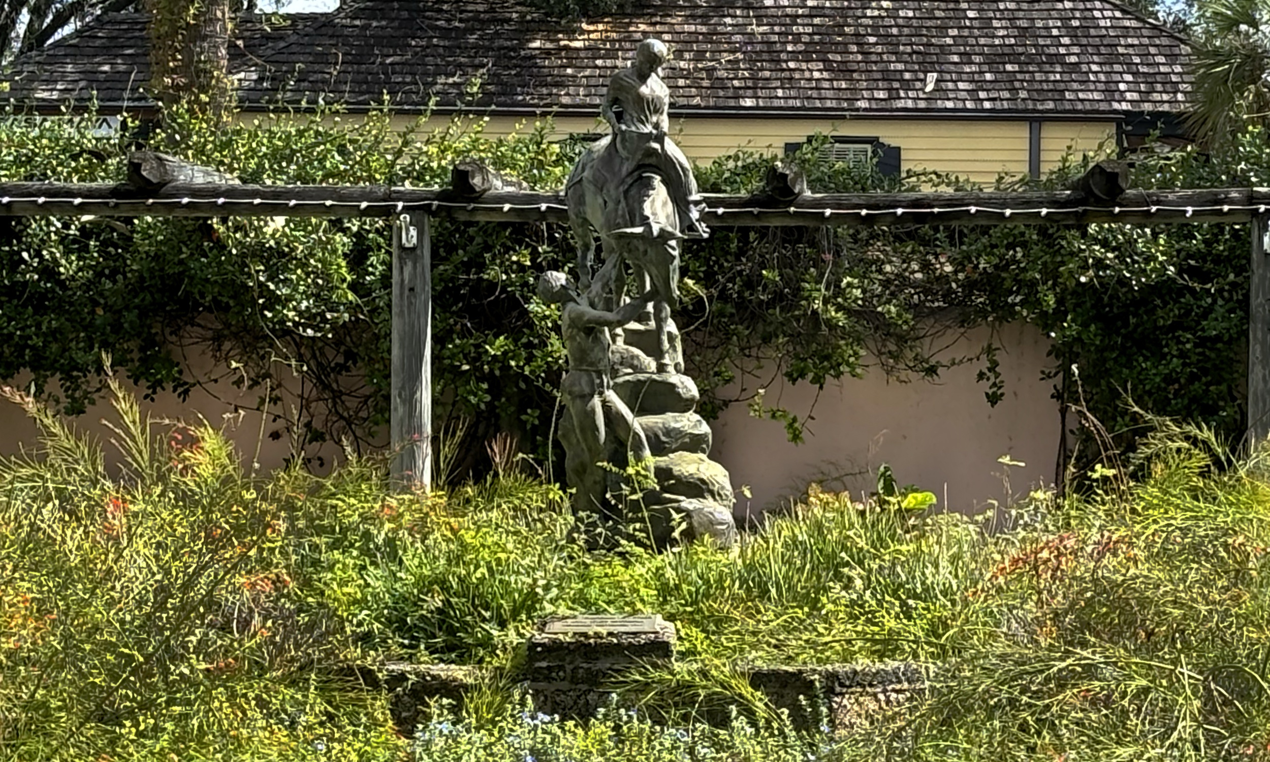 A sculpture of a queen in a garden