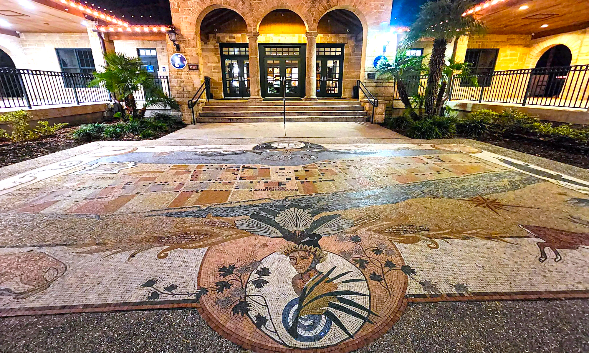 A mosaic on the ground in frot of the visitor information center