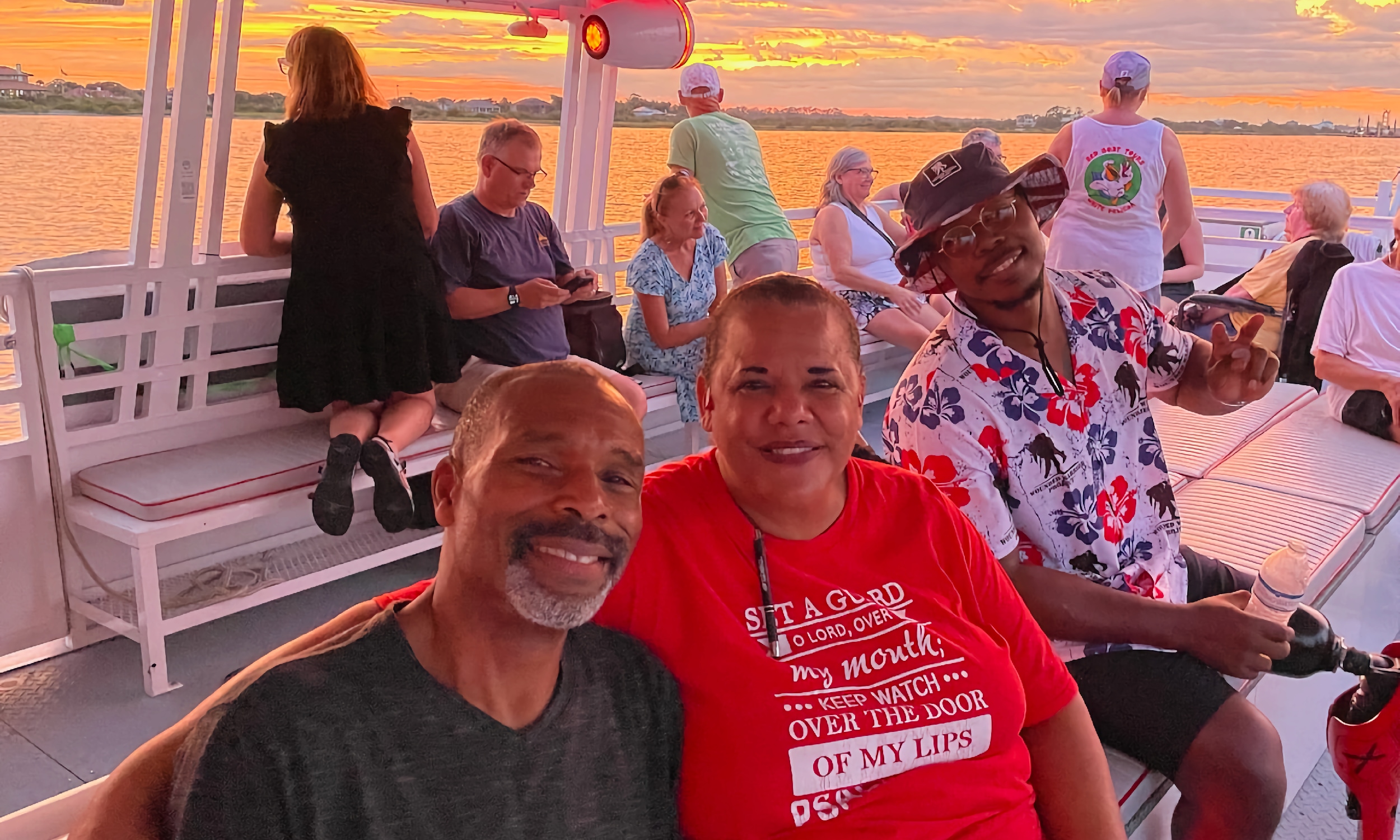 A military veteran and his family enjoy a sunset cruise aboard Red Boat Water Tours