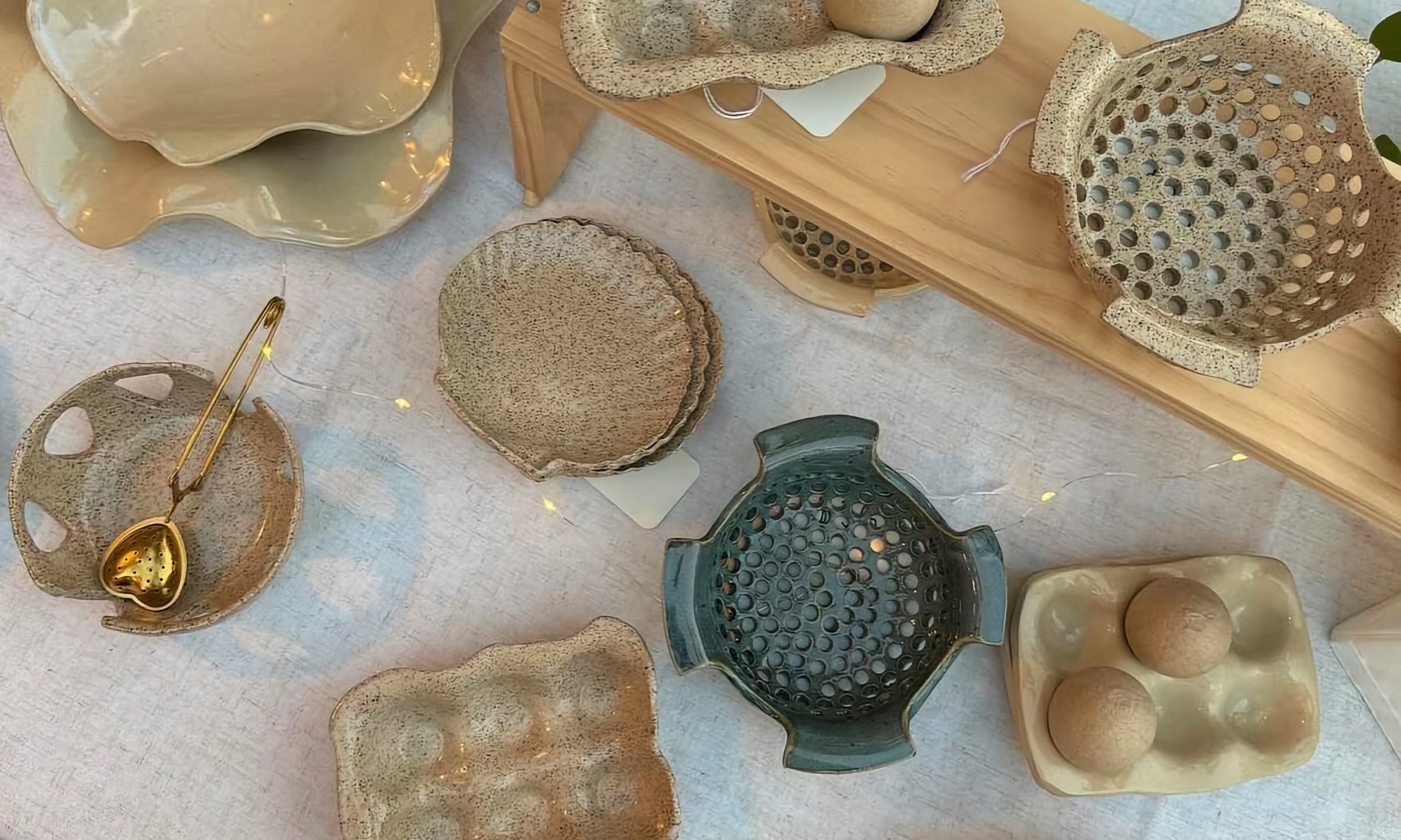 Local artist pottery displayed on a table