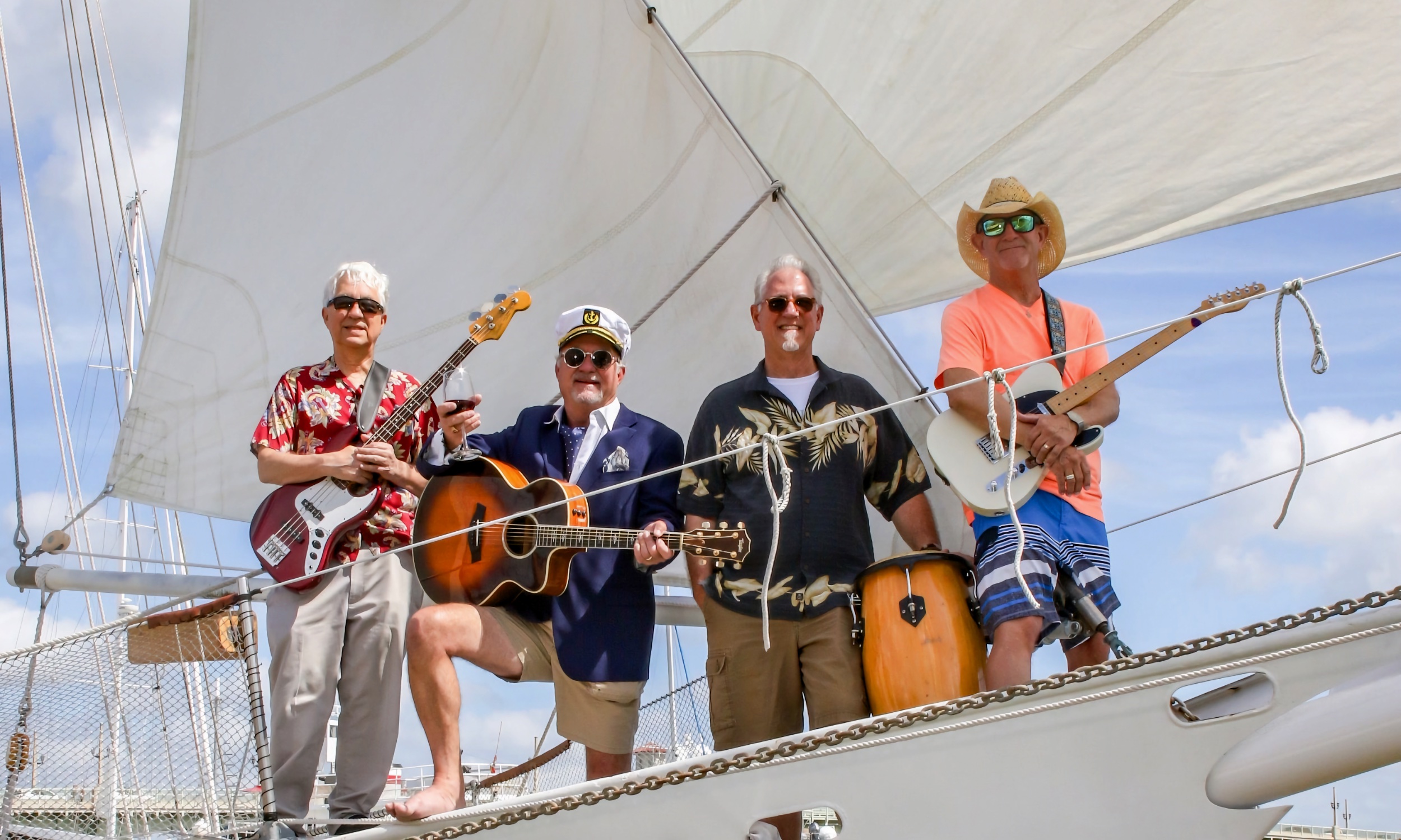 The band, Landfall, on a boat with their instruments