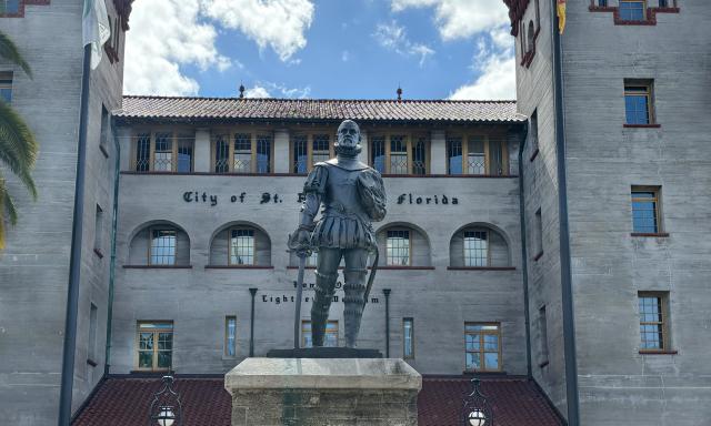 A sculpture of Pedro Menendez outside of a museum