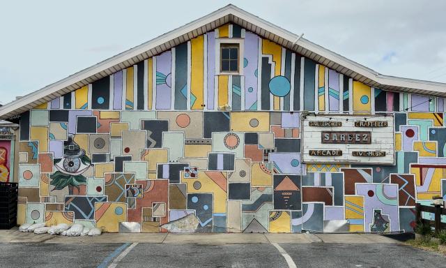 A colorful block mural on the side of a building