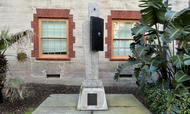 A modern sculpture with a black rectangle in the center