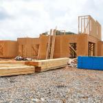 A new home under construction against a cloudy sky