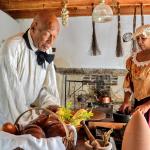 Two actors portraying servants from the past in the kitchen of the Ximenez-Fatio House Museum