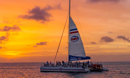 The Fury sailing catamaran on a sunset cruise