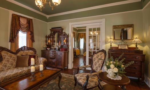 The parlor at this bed and breakfast offers several seating areas near the breakfast room