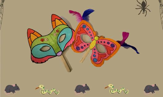 Two masks on sticks, a fox and a butterfly, brightly painted on a background that features little creatures and spiders