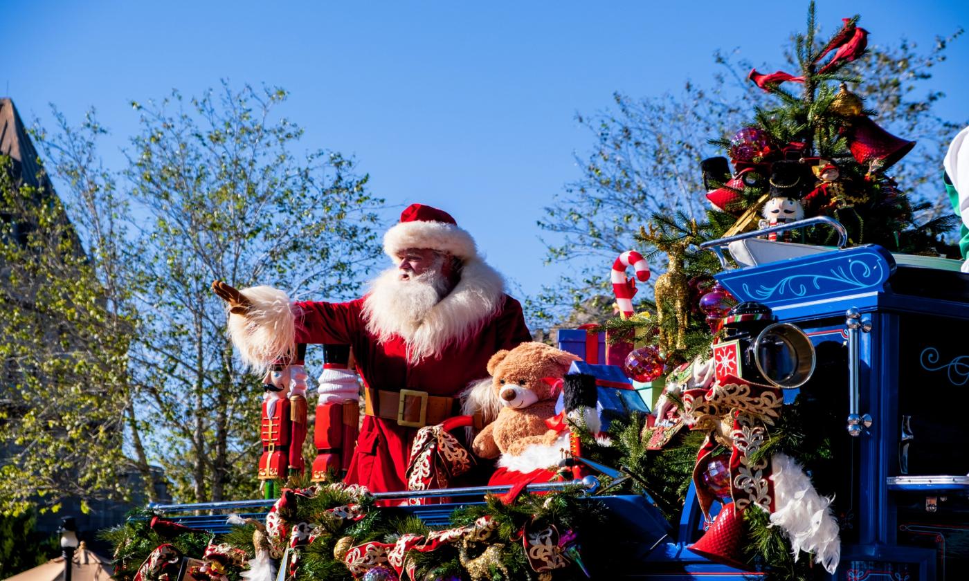 Santa greets people with a smile. 