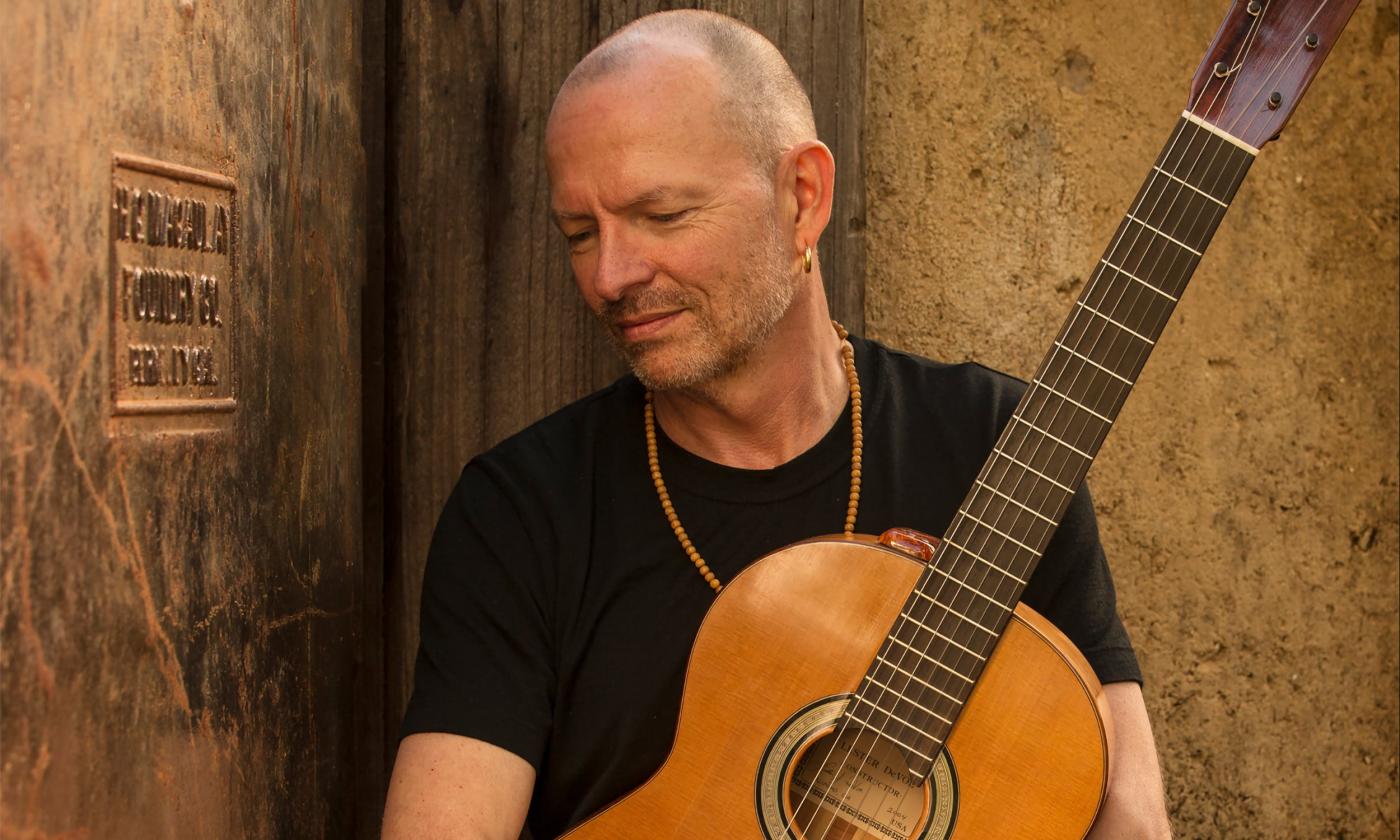 Instrumentalist Ottmar Liebert with his guitar.