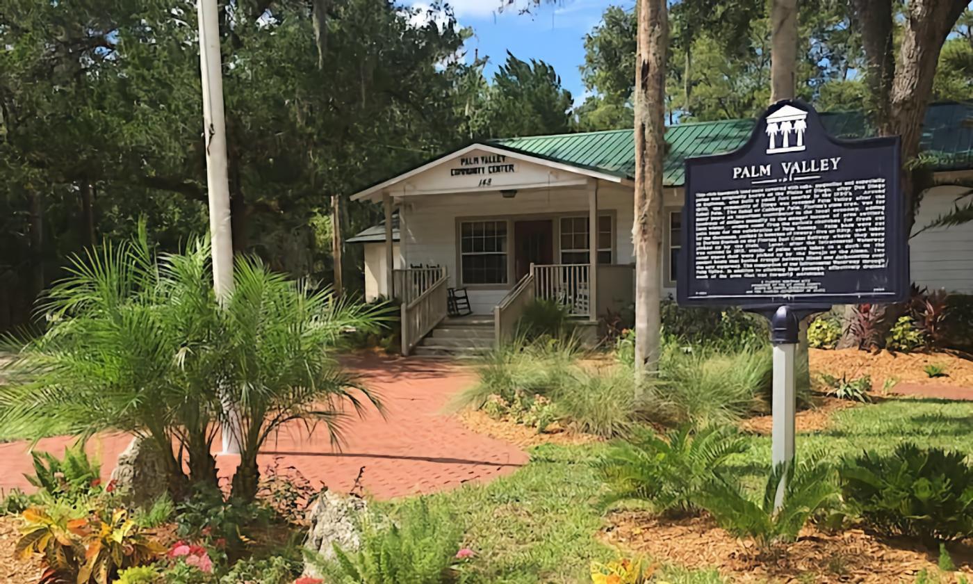 The Palm Valley Community Center with their historical plaque