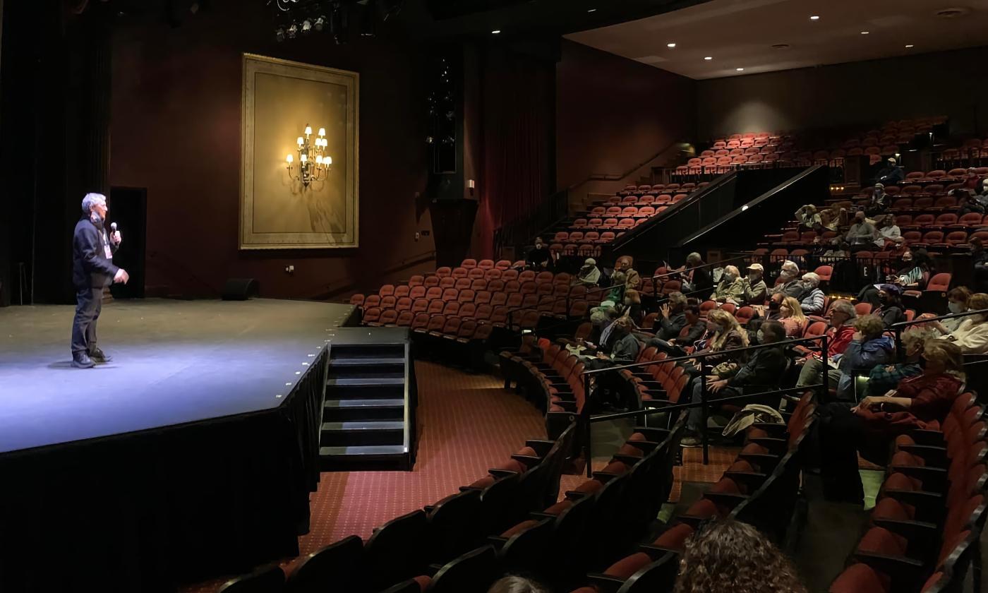 Gregory von Hausch stands on stage at Lewis Auditorium introducing the St. Augustine Film Festival