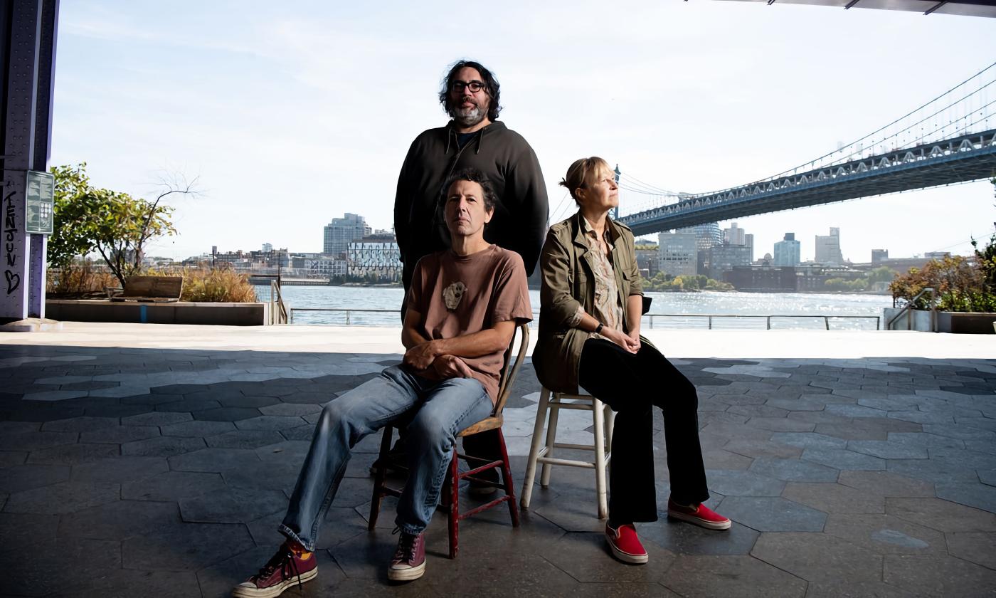 Yo La Tengo, posed near a city bridge, photo by Cheryl Dunn