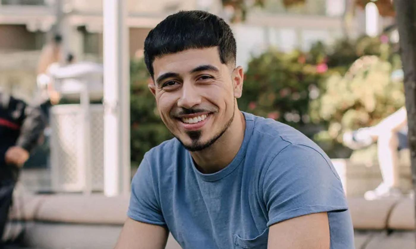 Rapper Kayvon Asemani smiling in headshot