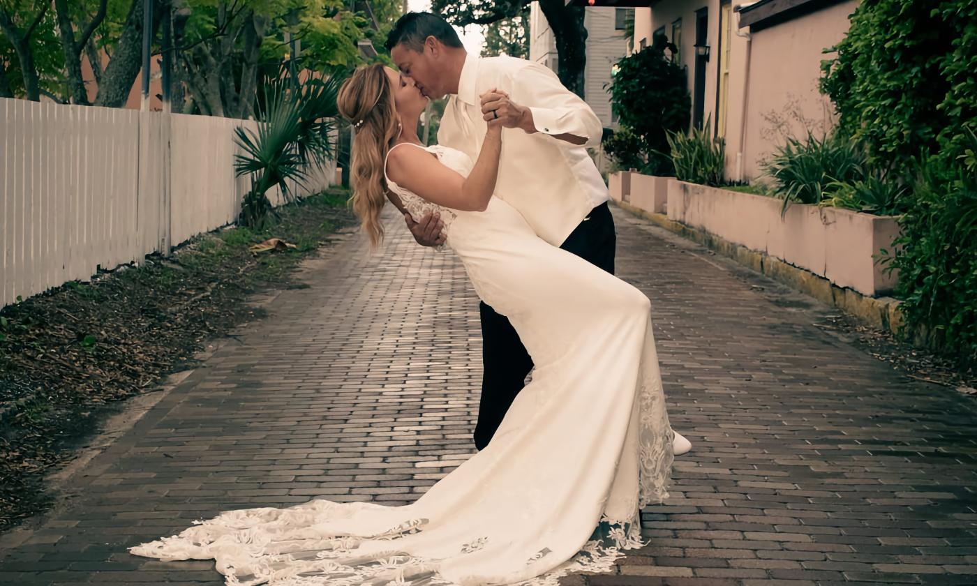 A wedding kiss on a brick street in the Oldest City