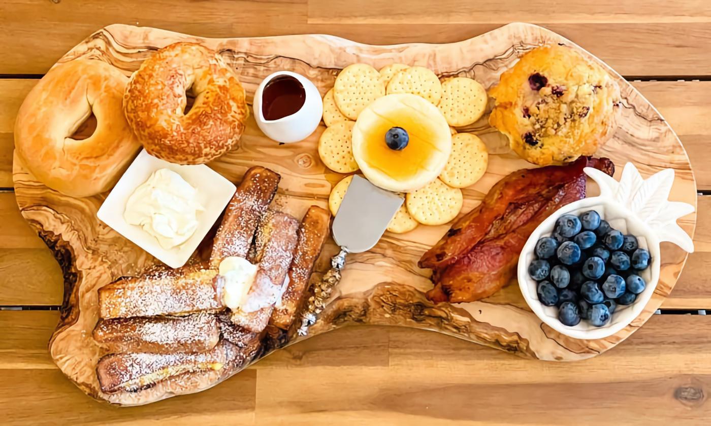 A bruncharcuterie board with assorted foods on display