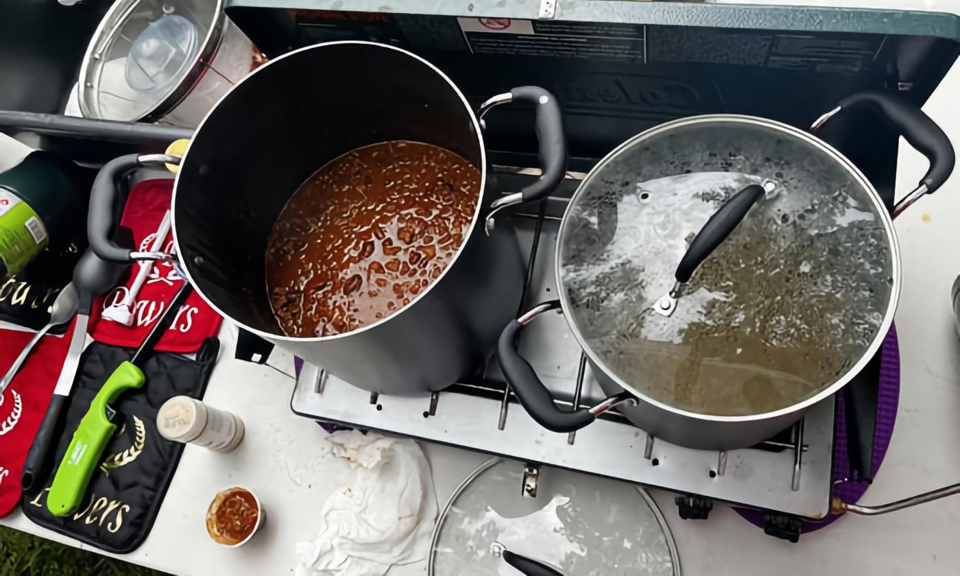 Pots of chili on a camp stove at an ICS sanctioned chili cook off.