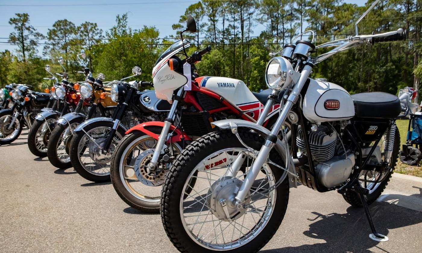 Vintage motorcycles lined up for viewing