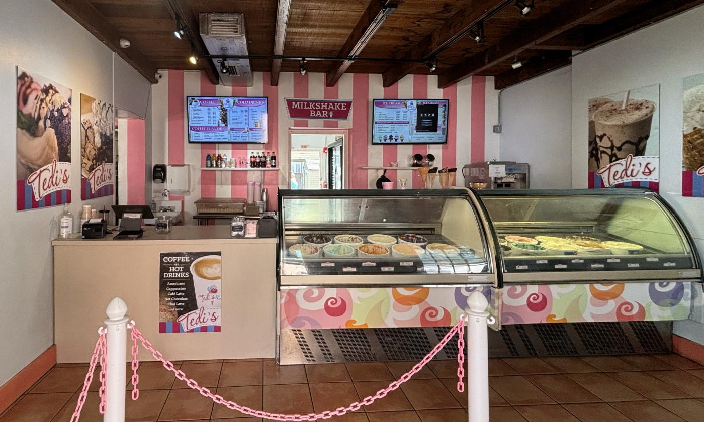 The counter area with the menu displayed on the back wall