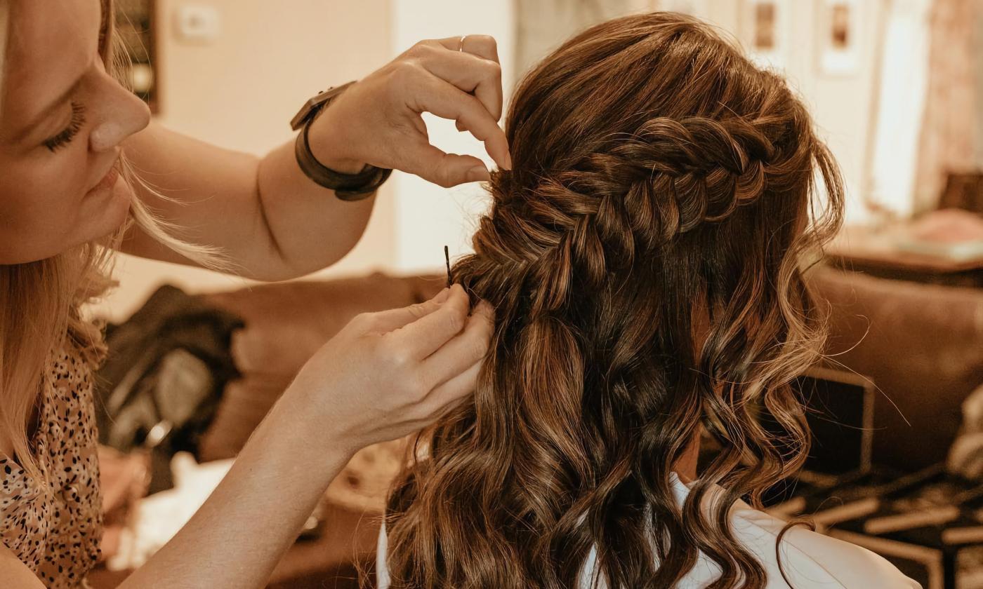 A bride getting her hair pinned