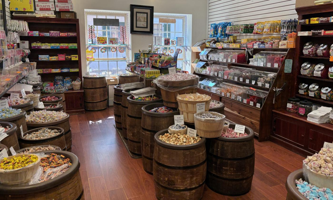 The layout of the shop with bins and shelves full of candy