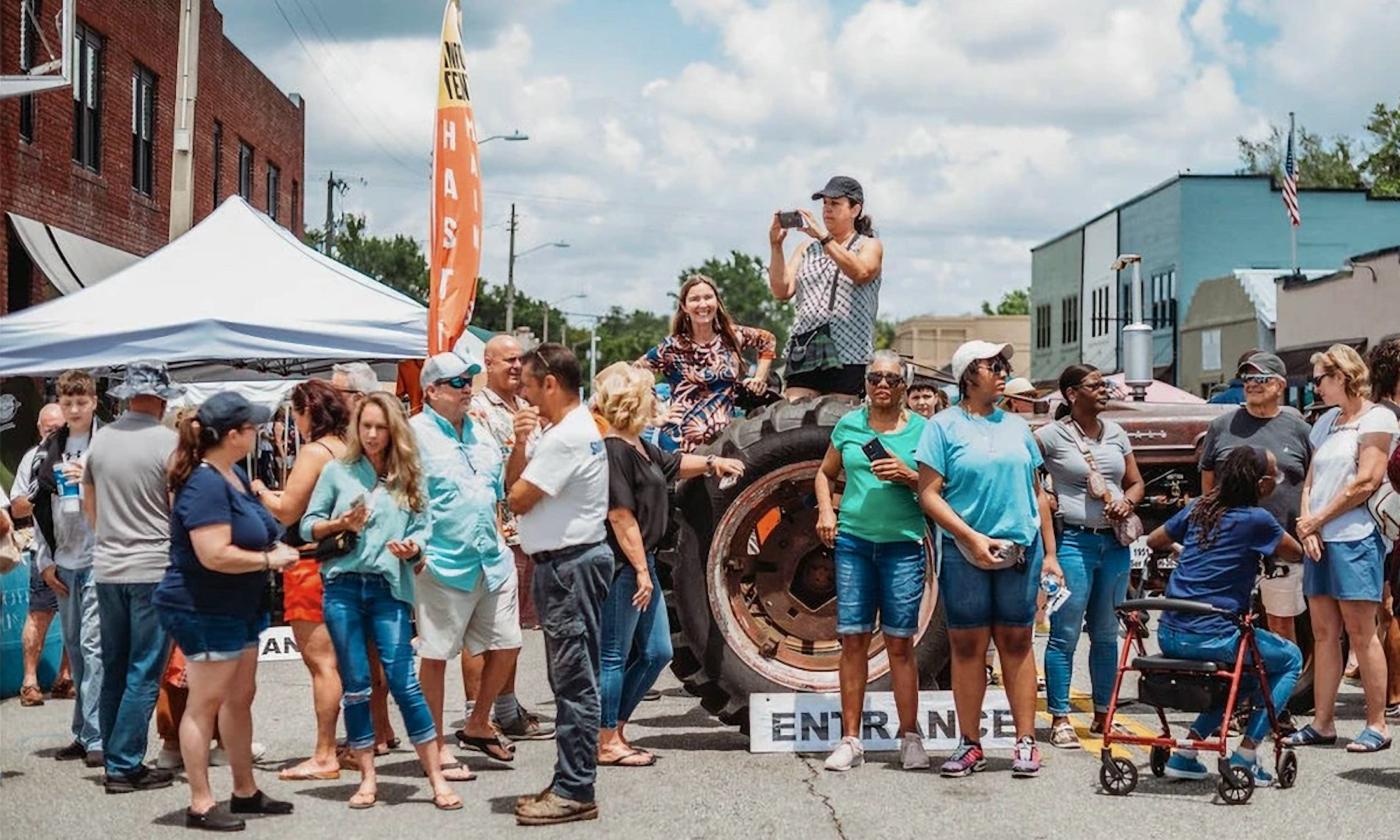 People on the street at a festival downtown