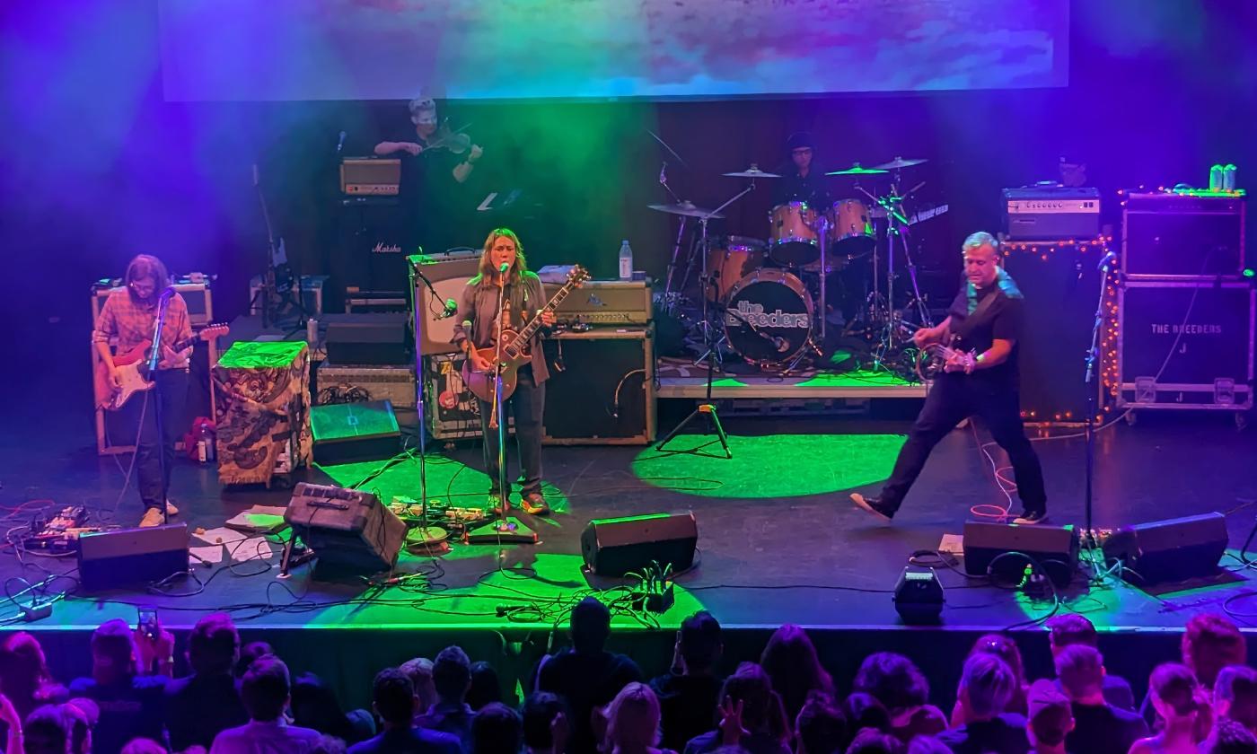 The band, The Breeders, in concert with multi-colored lights as the play