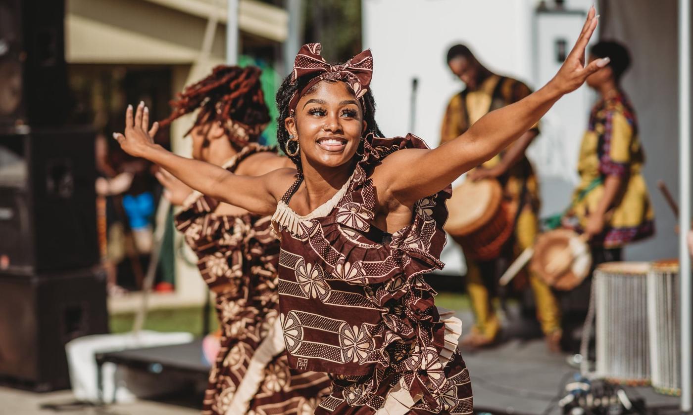 A woman happily dances at the Gullah Geechee Festival in Elkton, Florida