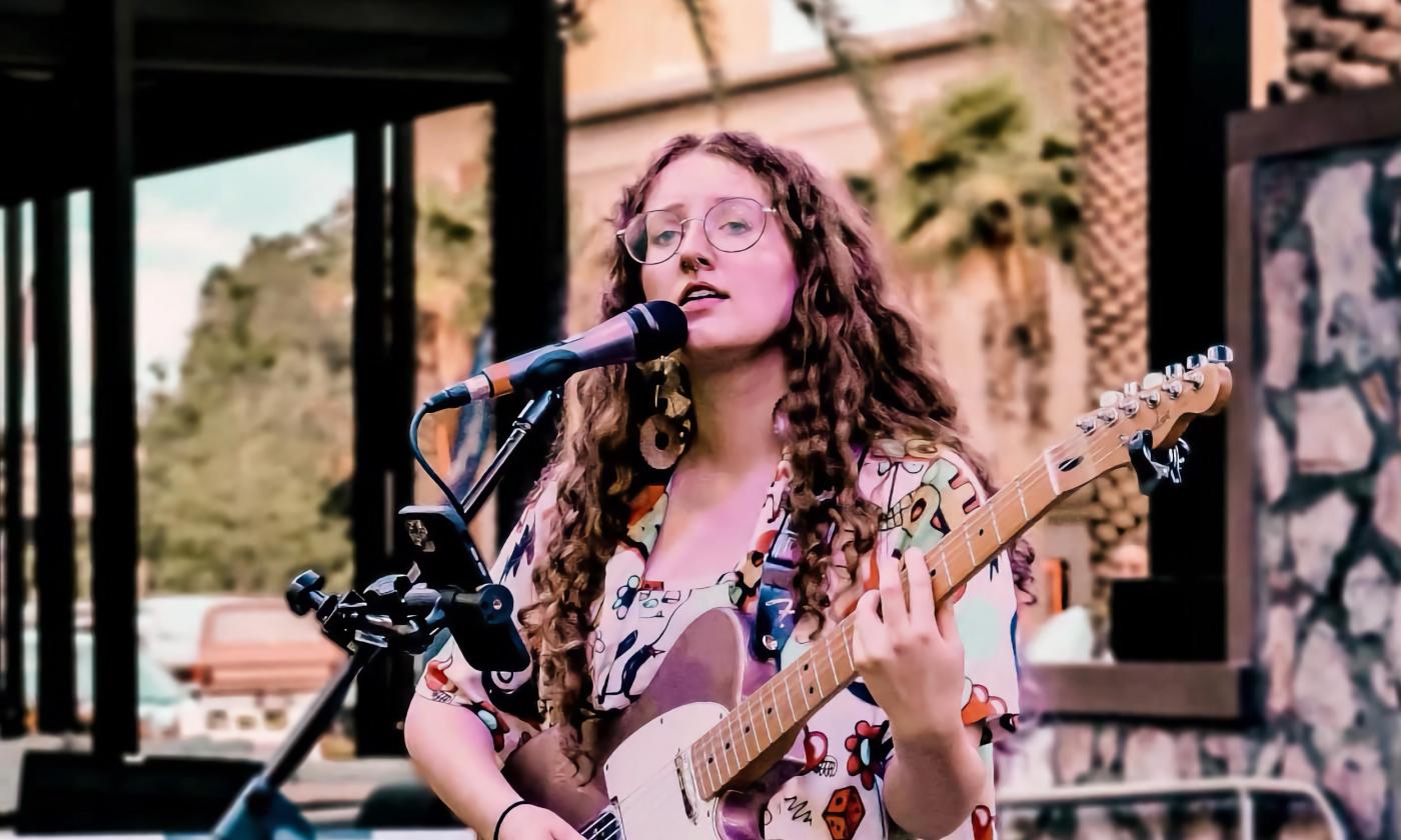 Lauren Woodall playing the guitar