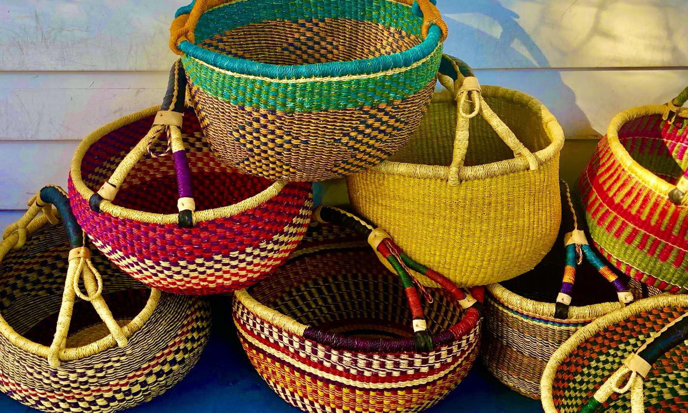 A pile of colorful market baskets