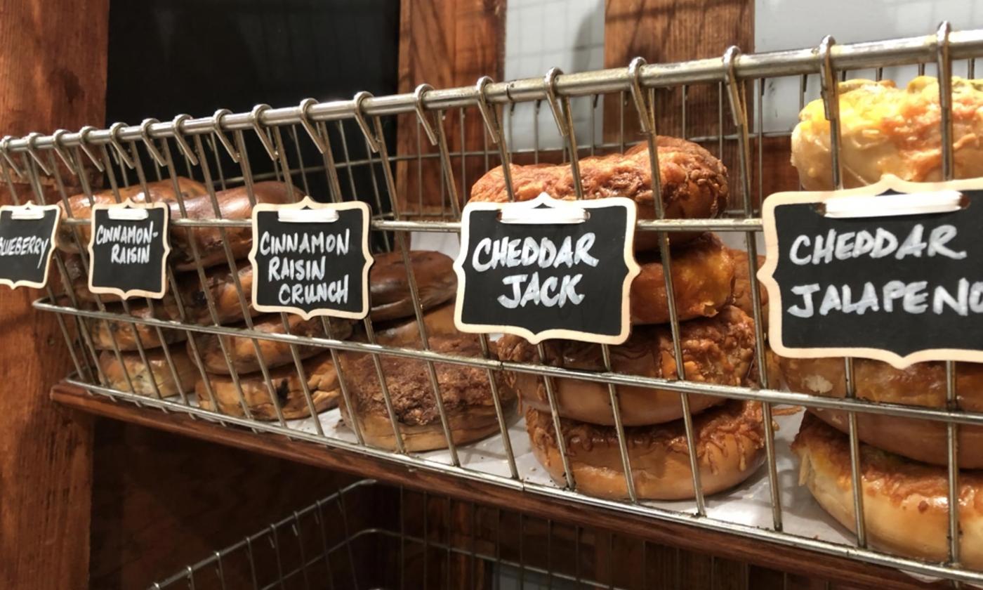 A rack of the various types of bagels sold