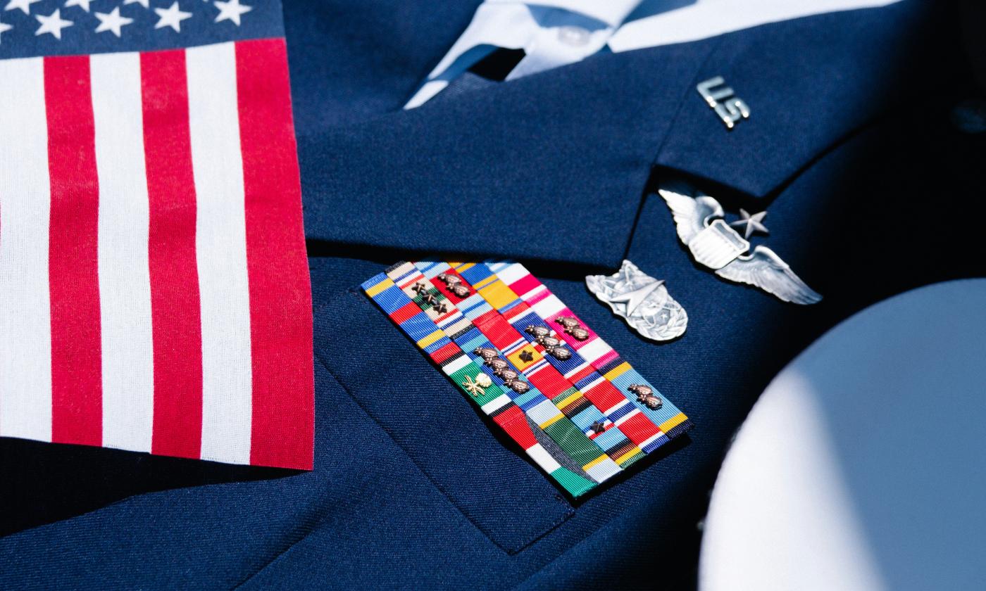 An Air Force dress blues uniform with an American flag