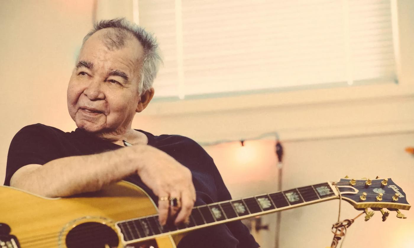 John Prine with his guitar, photo by Oh Boy Records