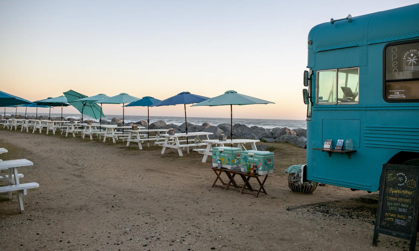 Shaded picnic tables overlooking the ocean