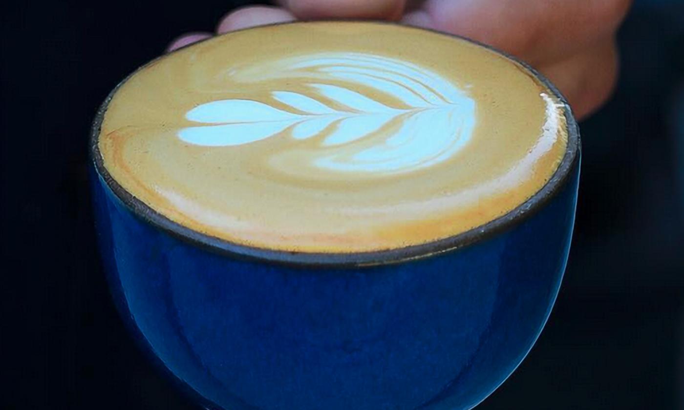 A cappuccino with a design on top