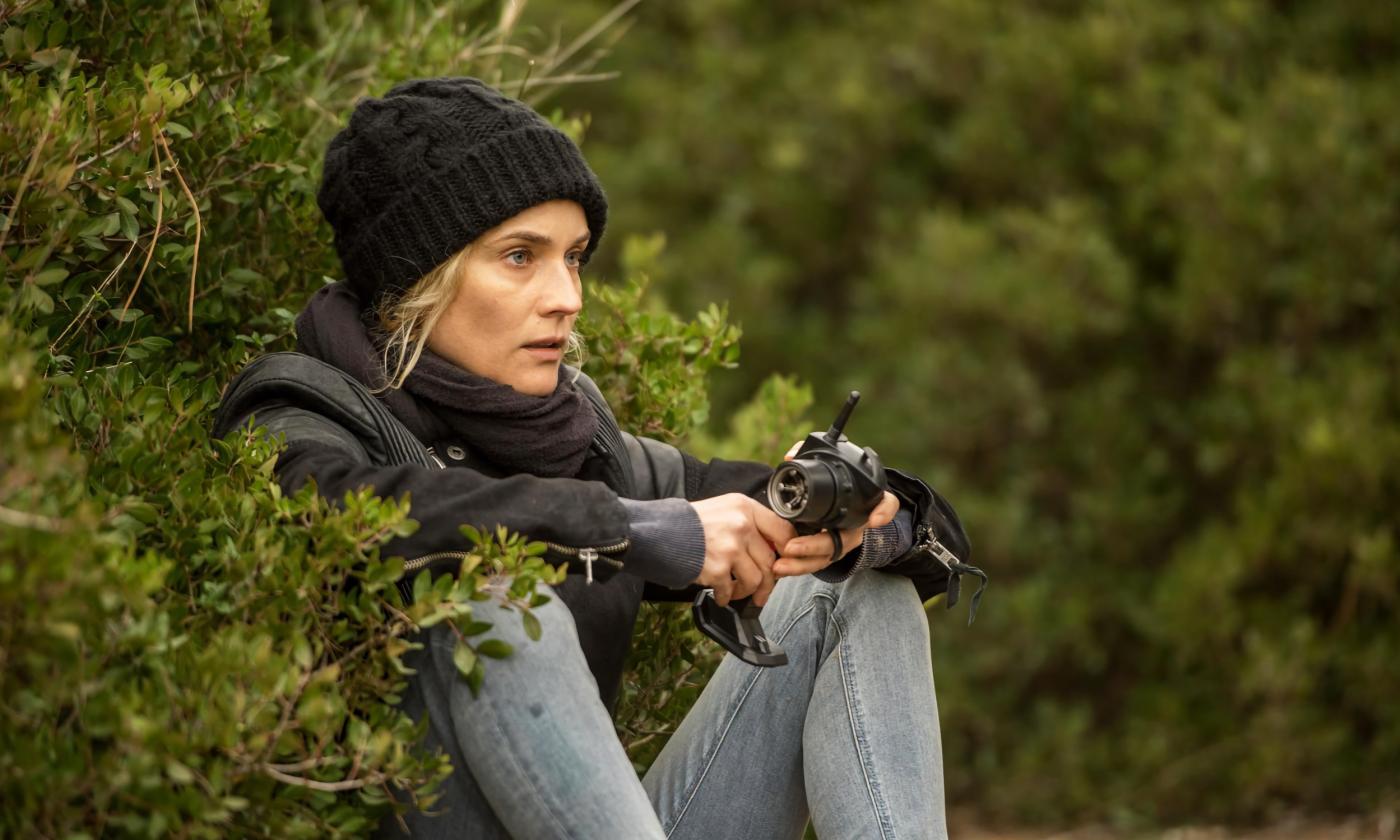 Katja sitting in a bush in the film, "In the Fade"